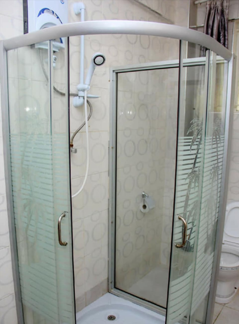 Shower, rainfall showerhead, slippers, towels