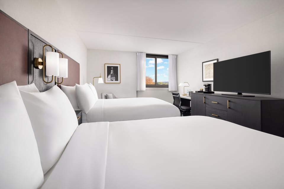 Down comforters, pillowtop beds, desk, laptop workspace