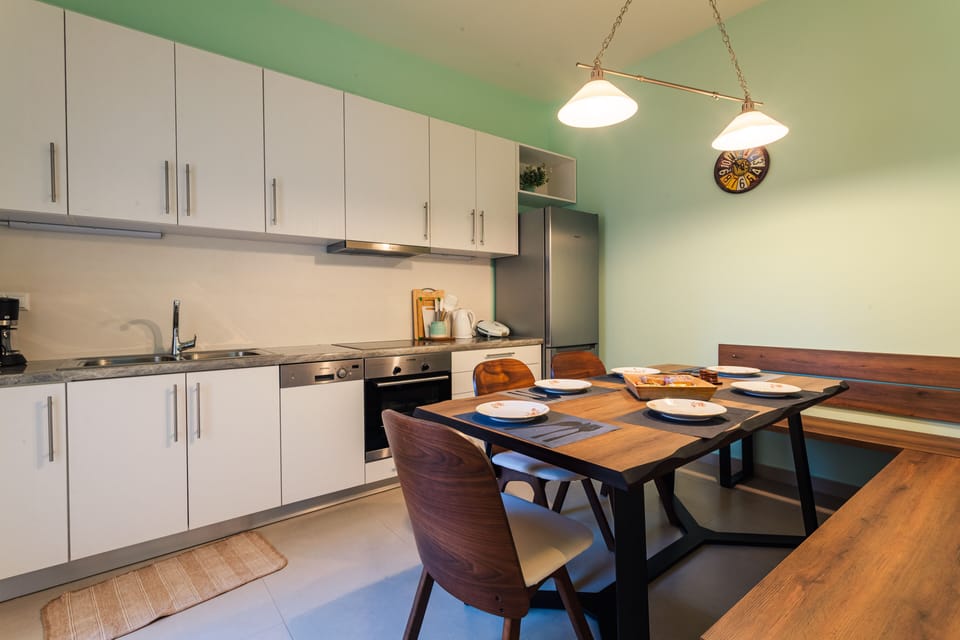 Apartment, 3 Bedrooms | Private kitchen | Full-size fridge, oven, stovetop, coffee/tea maker