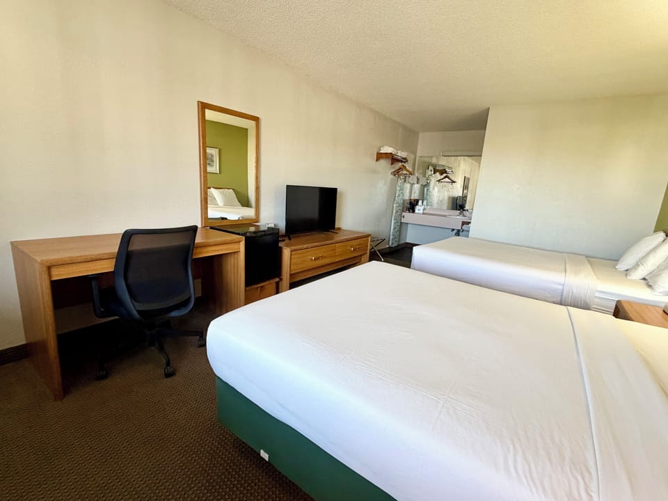 Standard Room, 2 Queen Beds | Iron/ironing board, cribs (free), WiFi (free), alarm clocks