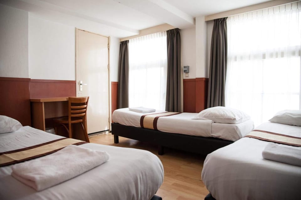 Basic Triple Room, 3 Twin Beds, Shared Bathroom | In-room safe, free WiFi, bed sheets