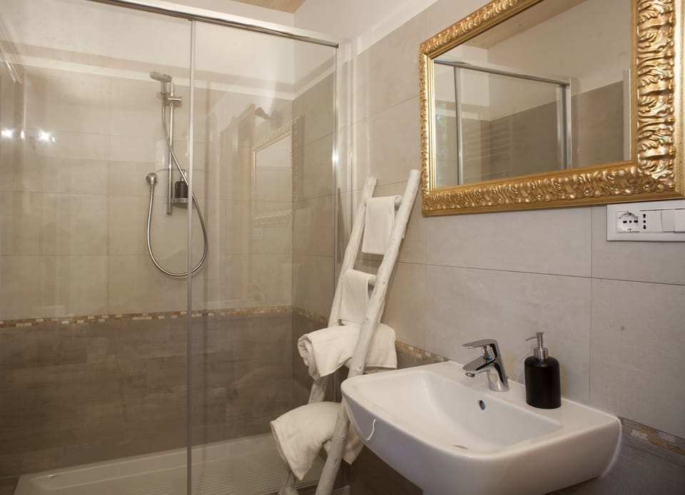 Shower, free toiletries, hair dryer, bathrobes
