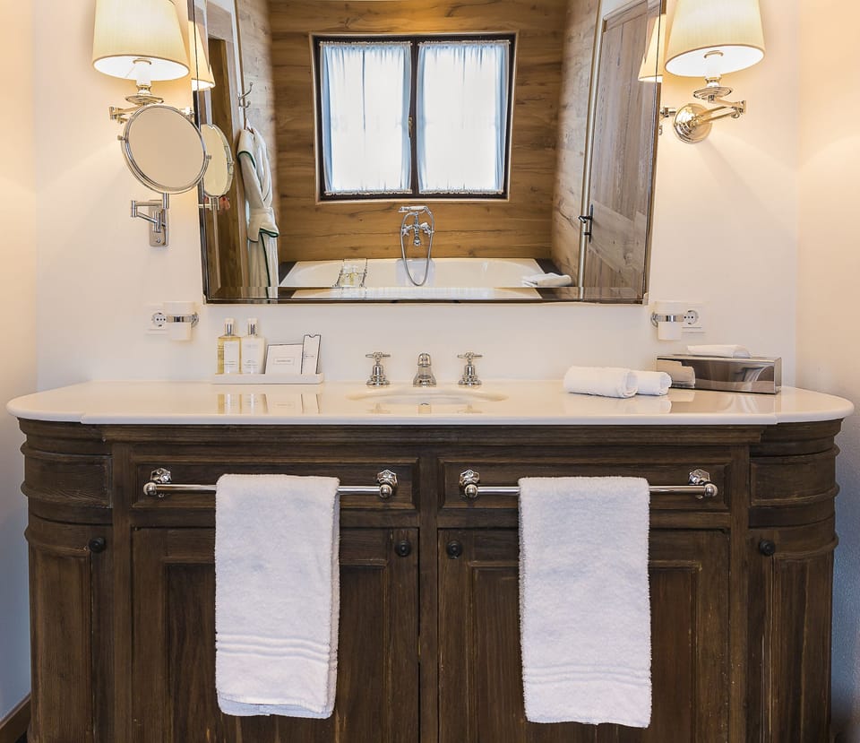 Designer toiletries, hair dryer, bathrobes, slippers
