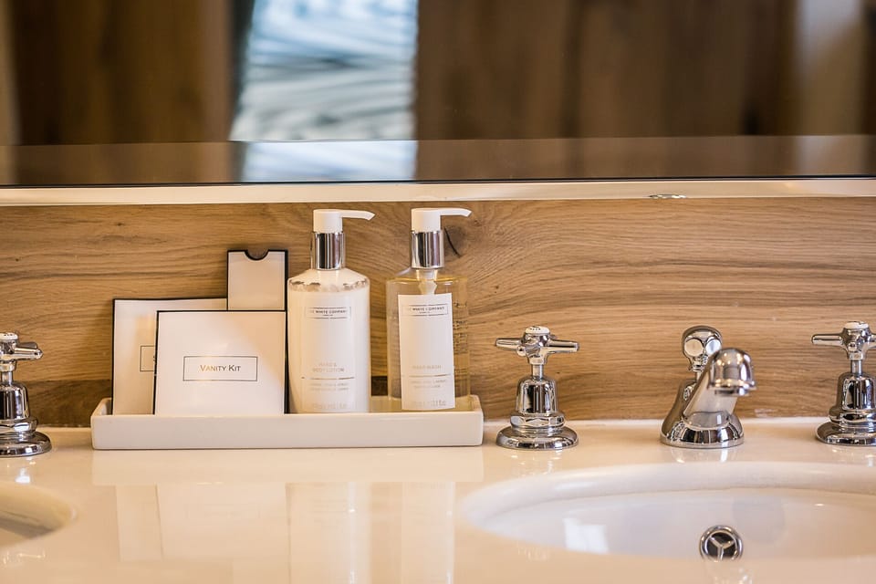 Designer toiletries, hair dryer, bathrobes, slippers