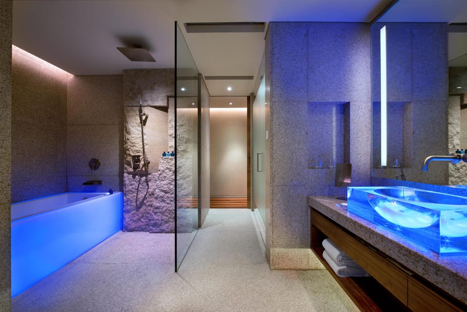 Separate tub and shower, designer toiletries, hair dryer, bathrobes