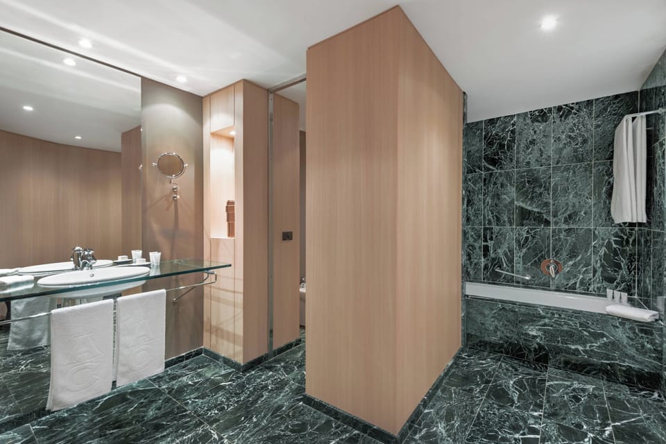 Designer toiletries, hair dryer, bidet, towels