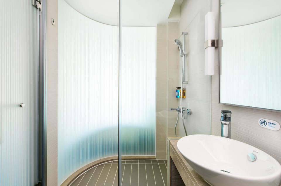 Rainfall showerhead, hair dryer, slippers, towels