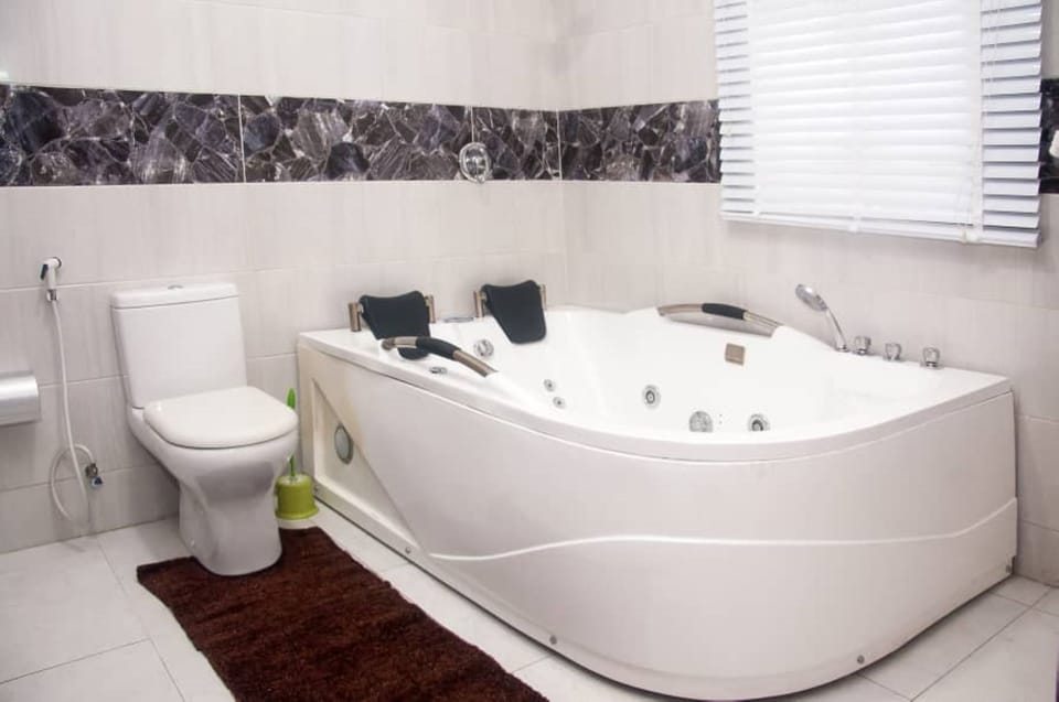Separate tub and shower, towels, soap, toilet paper