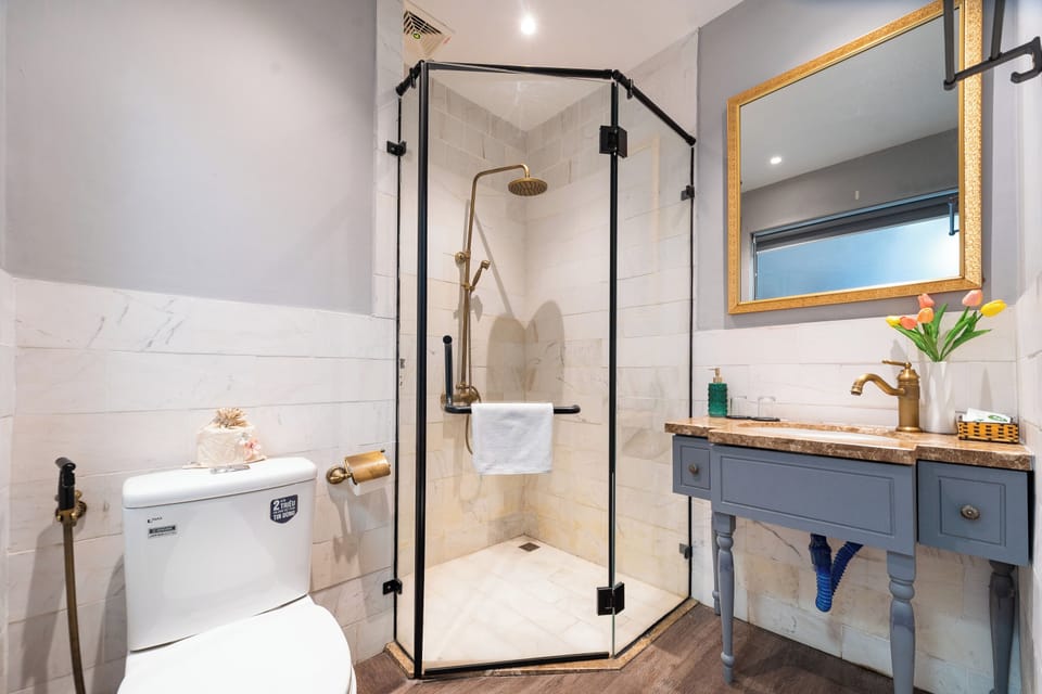 Family Room, 2 Double Beds | Bathroom | Shower, free toiletries, slippers, bidet