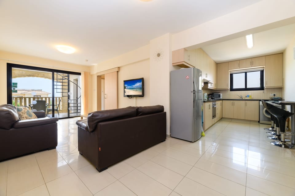 Apartment | Living room | 30-inch flat-screen TV with satellite channels, TV, DVD player