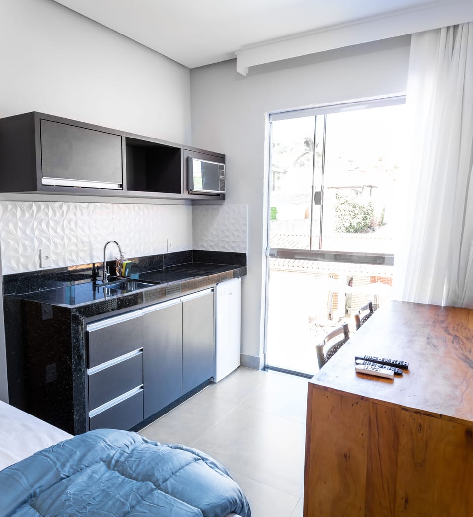 Suite, Kitchen, Pool View | Private kitchenette | Microwave