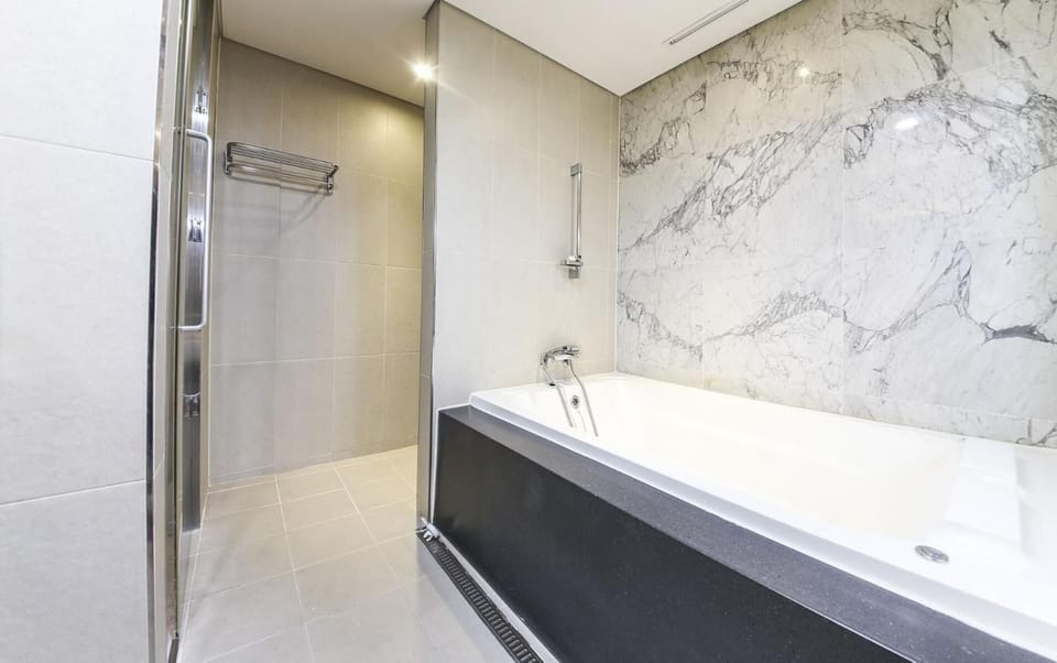 Separate tub and shower, hair dryer, towels, soap
