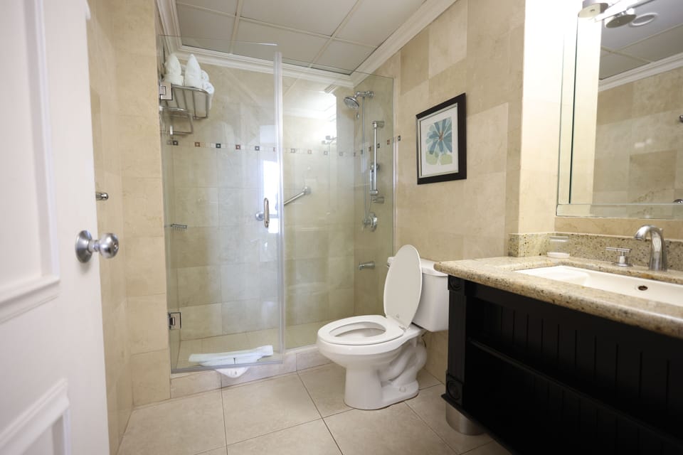 Suite, 1 Bedroom | Bathroom | Combined shower/tub, designer toiletries, hair dryer, slippers