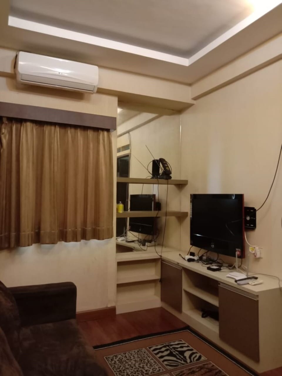 Family Room | Desk, iron/ironing board, bed sheets
