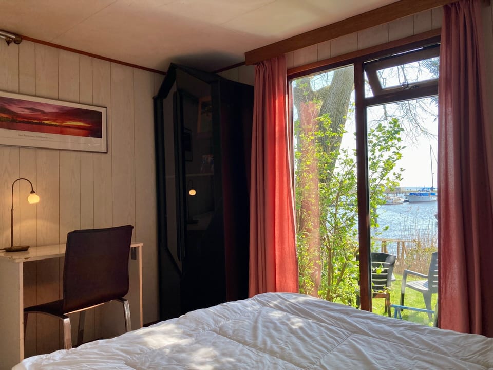 2 Pers - House König Lakeside of the Lauwersmeer With own Fishing Pier Sauna House in Anjum