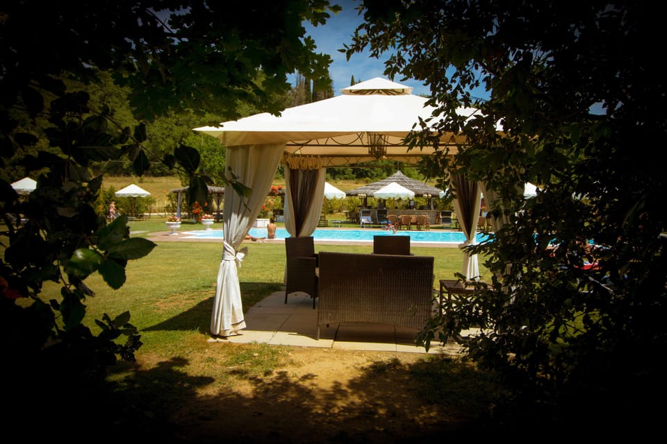 Seasonal outdoor pool, open 9:00 AM to 7:00 PM, pool umbrellas