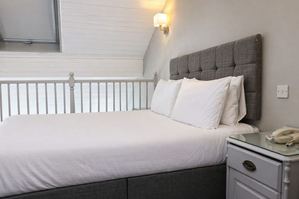 Superior Suite, 1 Bedroom, Mezzanine | Desk, iron/ironing board, free WiFi, bed sheets
