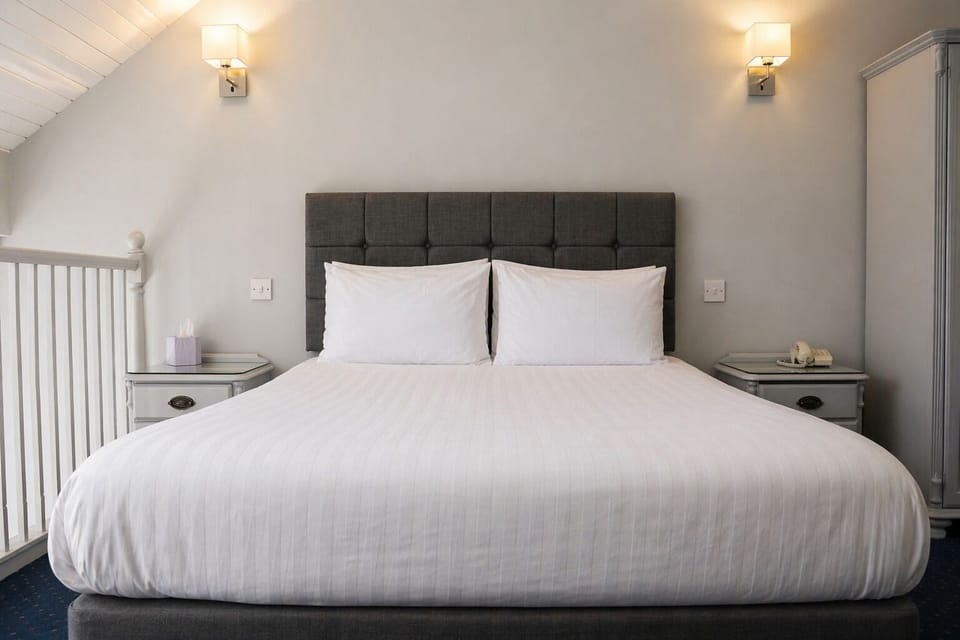 Superior Suite, 1 Bedroom, Mezzanine | Desk, iron/ironing board, free WiFi, bed sheets
