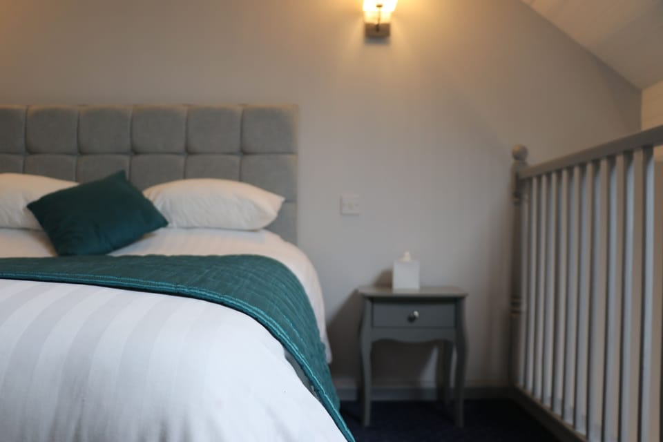 Superior Suite, 1 Bedroom, Mezzanine | Desk, iron/ironing board, free WiFi, bed sheets