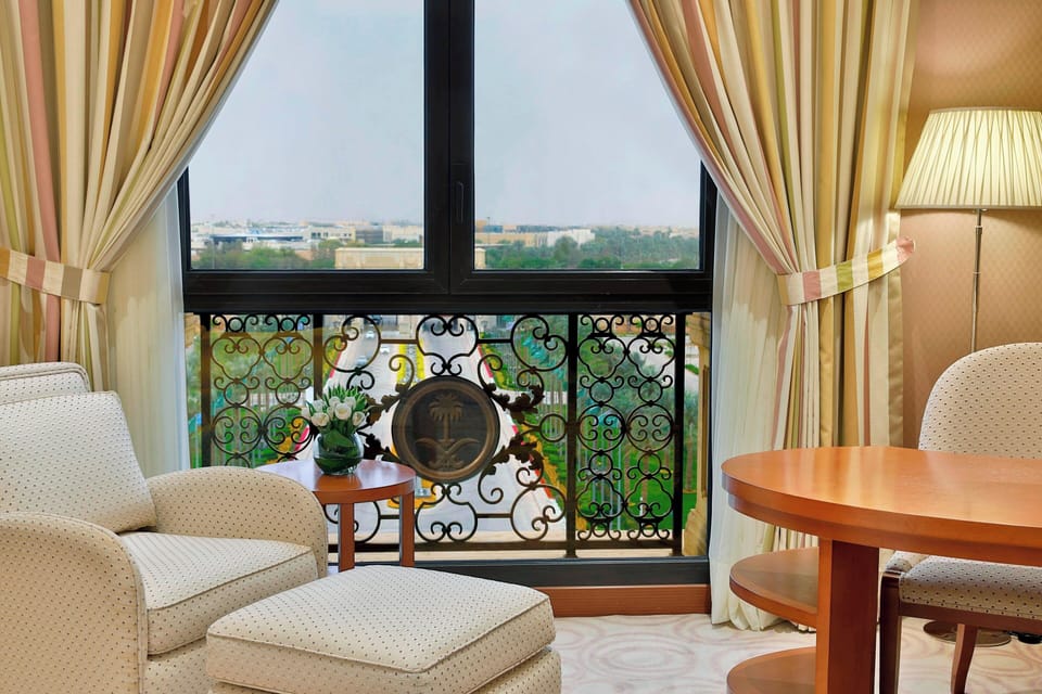 Room, 1 King Bed, Smoking (View) | Minibar, in-room safe, blackout drapes, iron/ironing board
