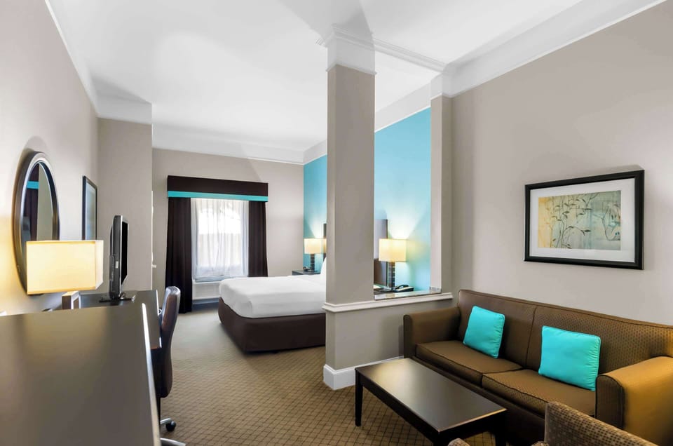 Suite, 1 King Bed, Non Smoking | Premium bedding, desk, laptop workspace, iron/ironing board