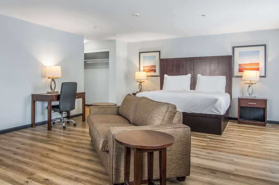 Suite, Multiple Beds (1 King Bed 1 Queen Bed) | Desk, blackout drapes, free WiFi, bed sheets