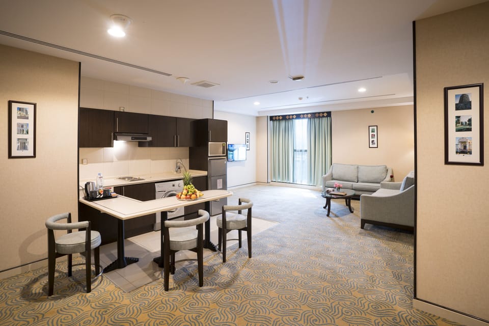 Deluxe Suite, 1 Bedroom | Living room | TV