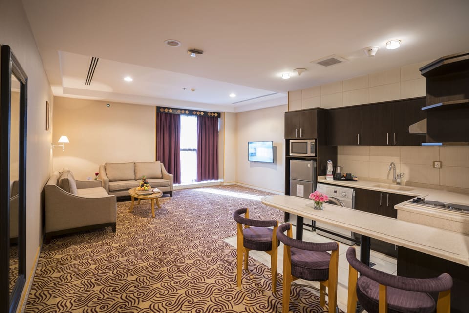 Deluxe Suite, 1 Bedroom | Living area | TV