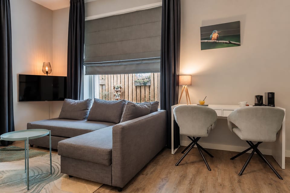 Comfort Plus Room | Living area | 32-inch TV with cable channels, foosball, table tennis