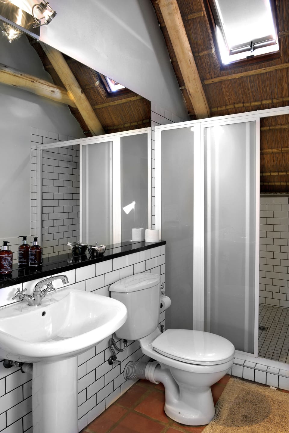 Separate tub and shower, rainfall showerhead, free toiletries