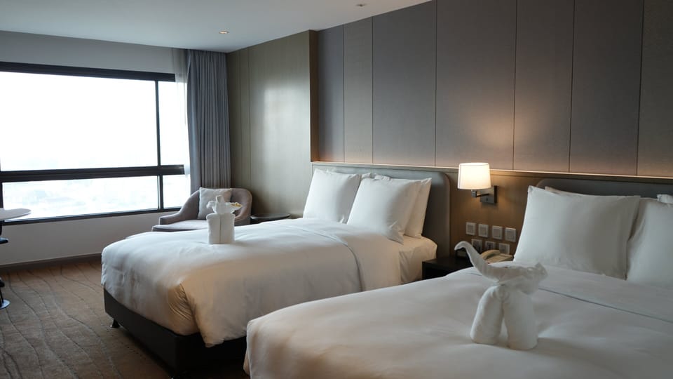 Grand Suite, 2 Bedrooms, River View | Minibar, in-room safe, desk, laptop workspace