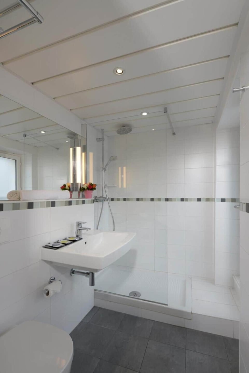 Rainfall showerhead, eco-friendly toiletries, hair dryer, towels