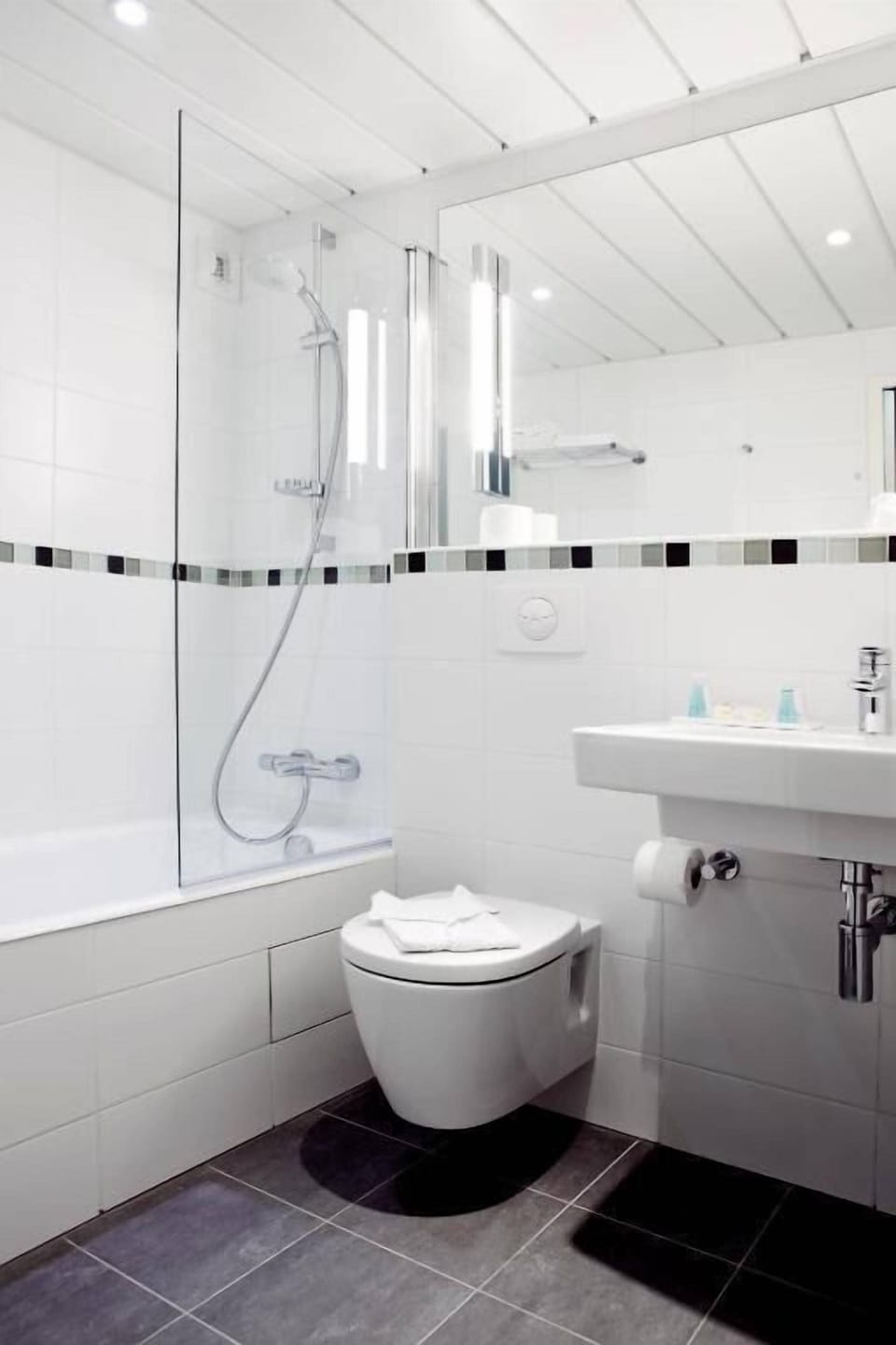 Rainfall showerhead, eco-friendly toiletries, hair dryer, towels