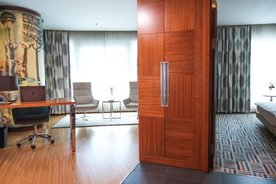 Deluxe Suite, 1 King Bed | Living area | LCD TV, fireplace