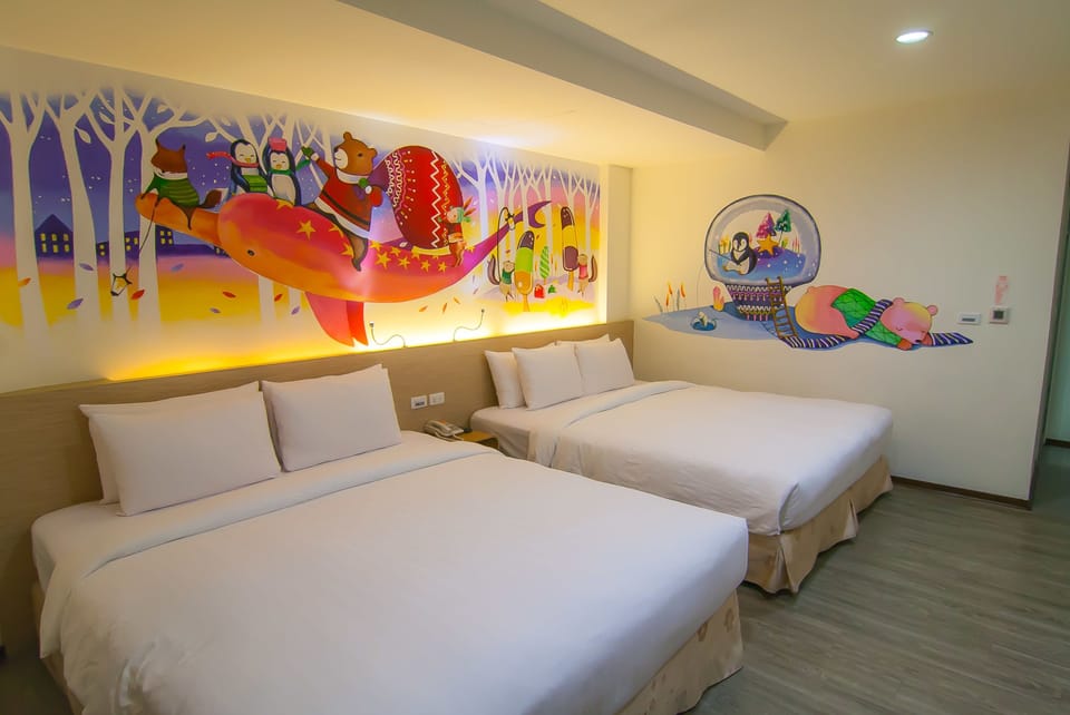 Deluxe Quadruple Room, 2 Queen Beds | Down comforters, minibar, in-room safe, individually decorated