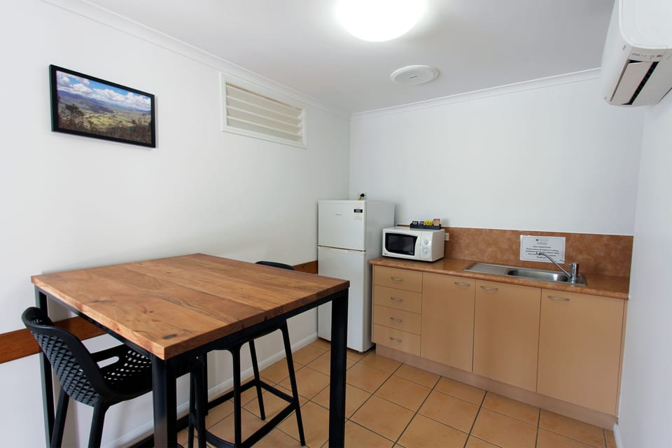 Suite, 1 Bedroom | Desk, laptop workspace, blackout drapes, iron/ironing board