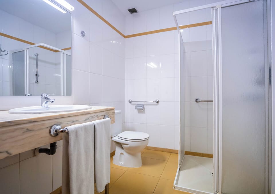 Bathtub, eco-friendly toiletries, hair dryer, bidet