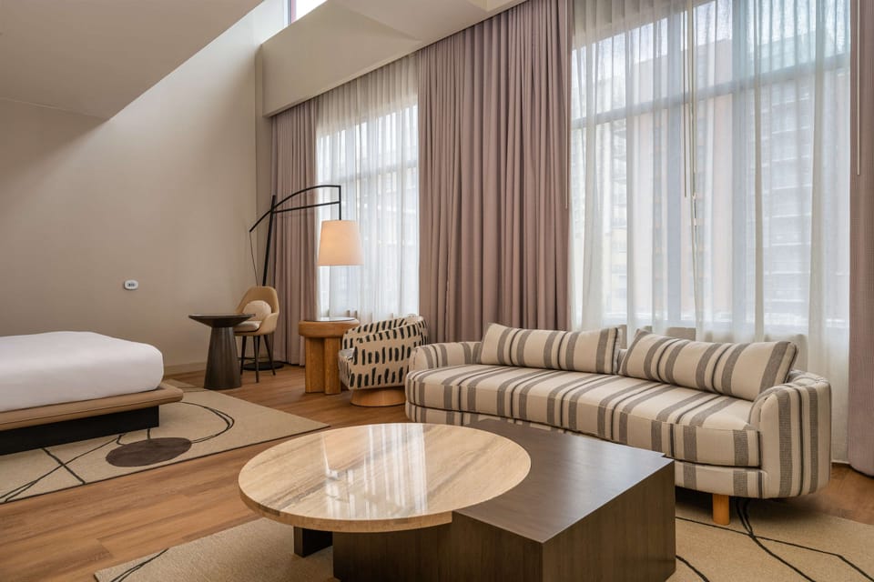 Gaslamp Quarter Loft Suite - 1 King | Living area | 60-inch flat-screen TV with cable channels, TV, pay movies