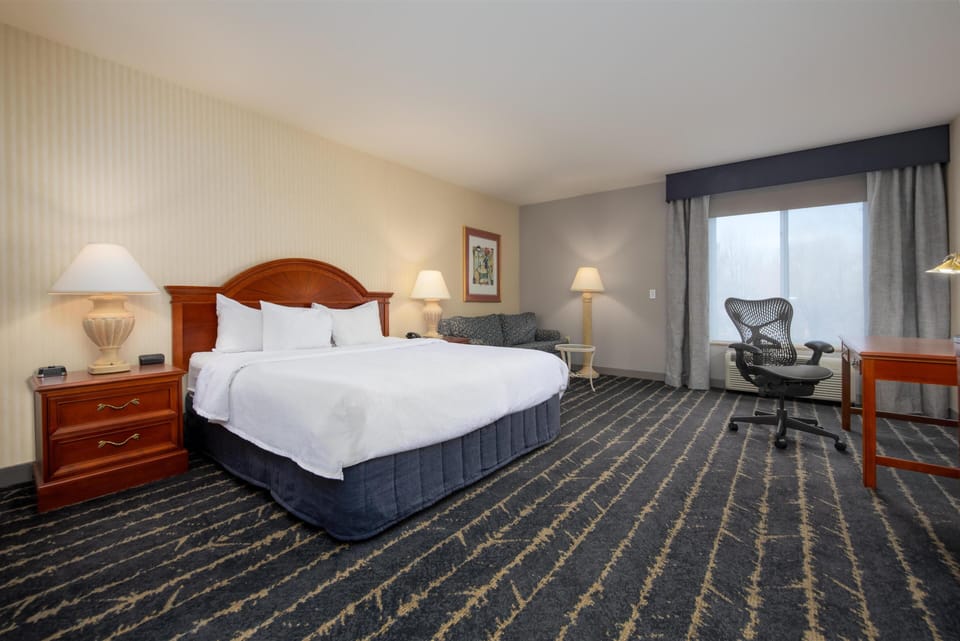 Premium bedding, desk, laptop workspace, iron/ironing board