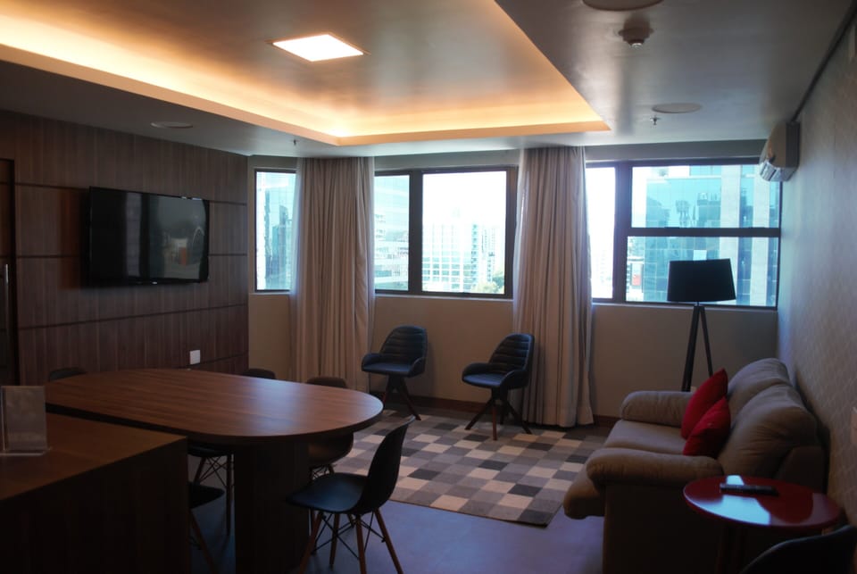 Premium Room | Living area | 32-inch LCD TV with cable channels