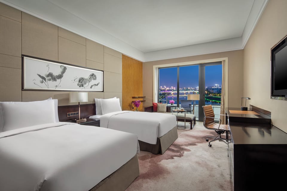 Premium Room, 2 Twin Beds, River View | In-room safe, desk, laptop workspace, blackout drapes