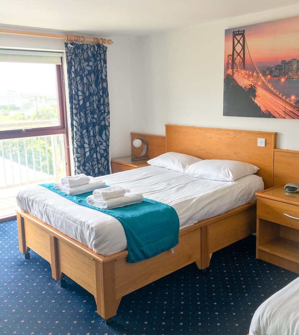 Family Room | Desk, blackout drapes, free WiFi, bed sheets