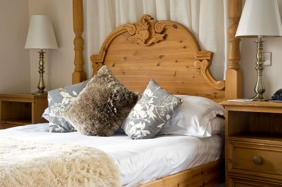 Room Four Poster | Premium bedding, desk, blackout drapes, iron/ironing board (on request)