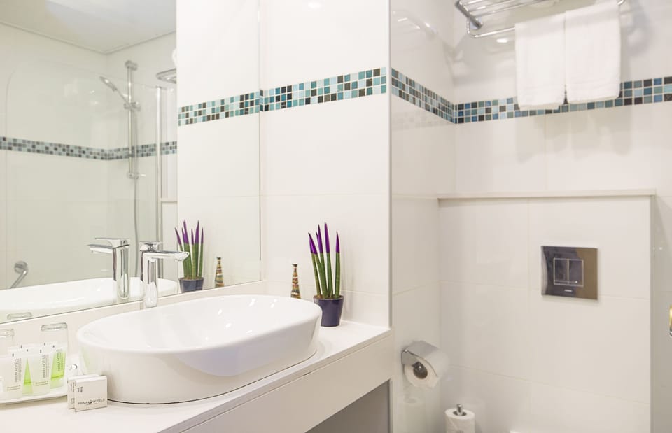 Combined shower/tub, free toiletries, bathrobes, slippers