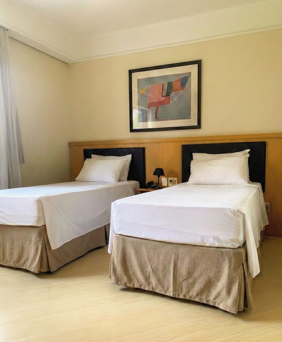 Twin Room | Minibar, in-room safe, desk, soundproofing