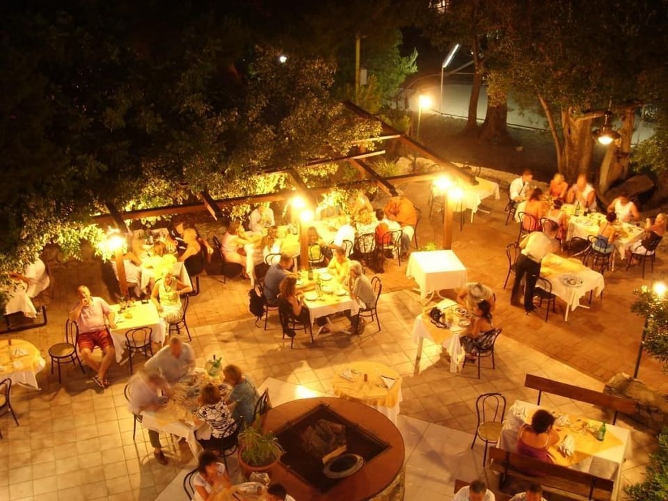 Lunch, dinner served; local cuisine, garden views 