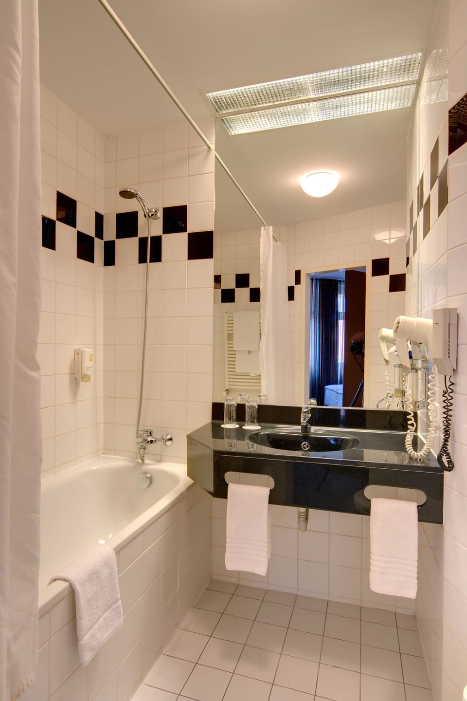 Designer toiletries, hair dryer, towels