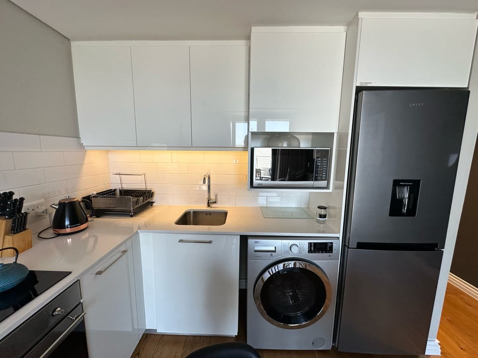 Apartment 317 | Private kitchen | Full-size fridge, microwave, oven, stovetop