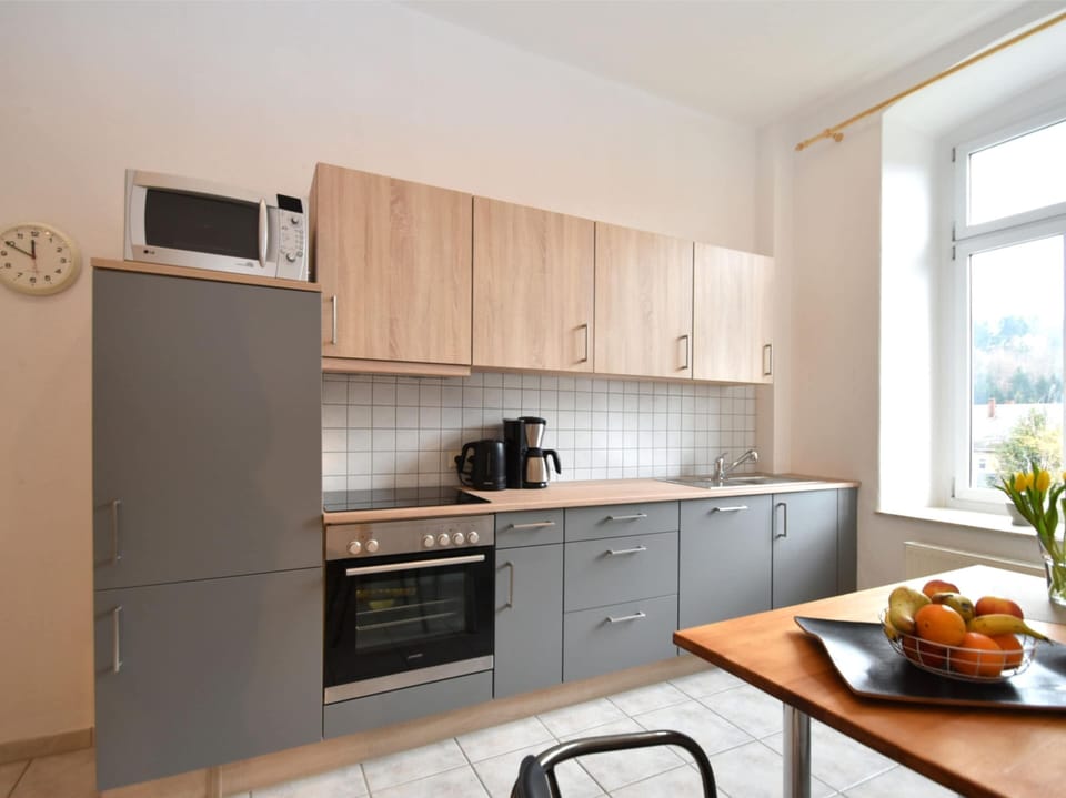 Villa | Private kitchen | Stovetop, electric kettle, highchair
