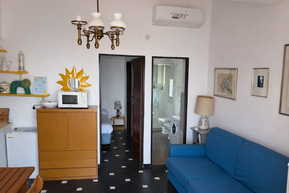 Apartment, 1 Double Bed with Sofa bed, Terrace, Sea View | Living area | 32-inch flat-screen TV with cable channels